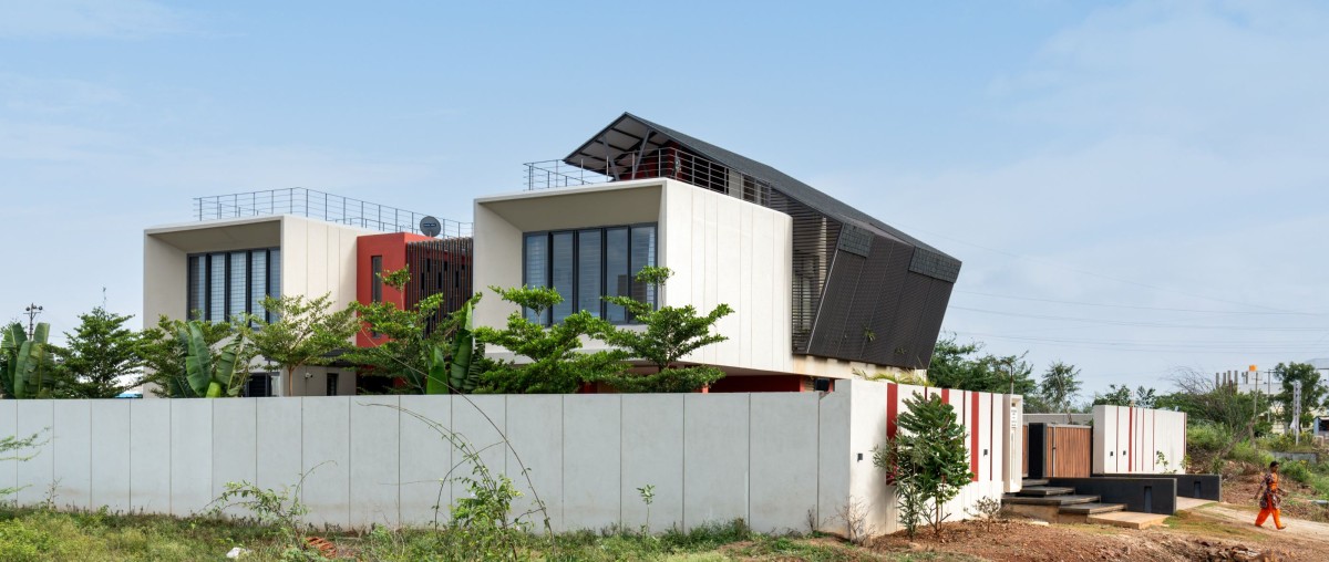 North Side view of The Red Courtyard House by Jacob + Rathodi Architects