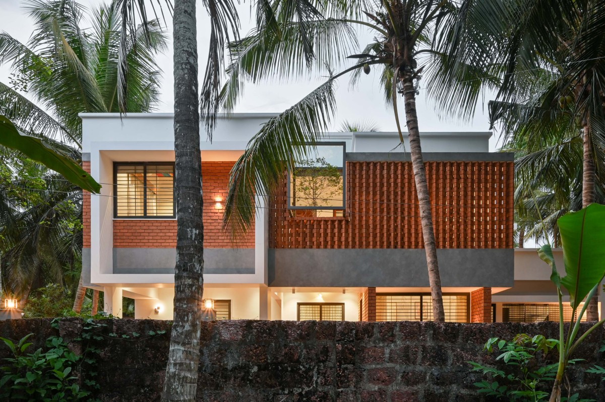 Dusk light exterior view of Brick Screen House by HONEYCOMB Architects