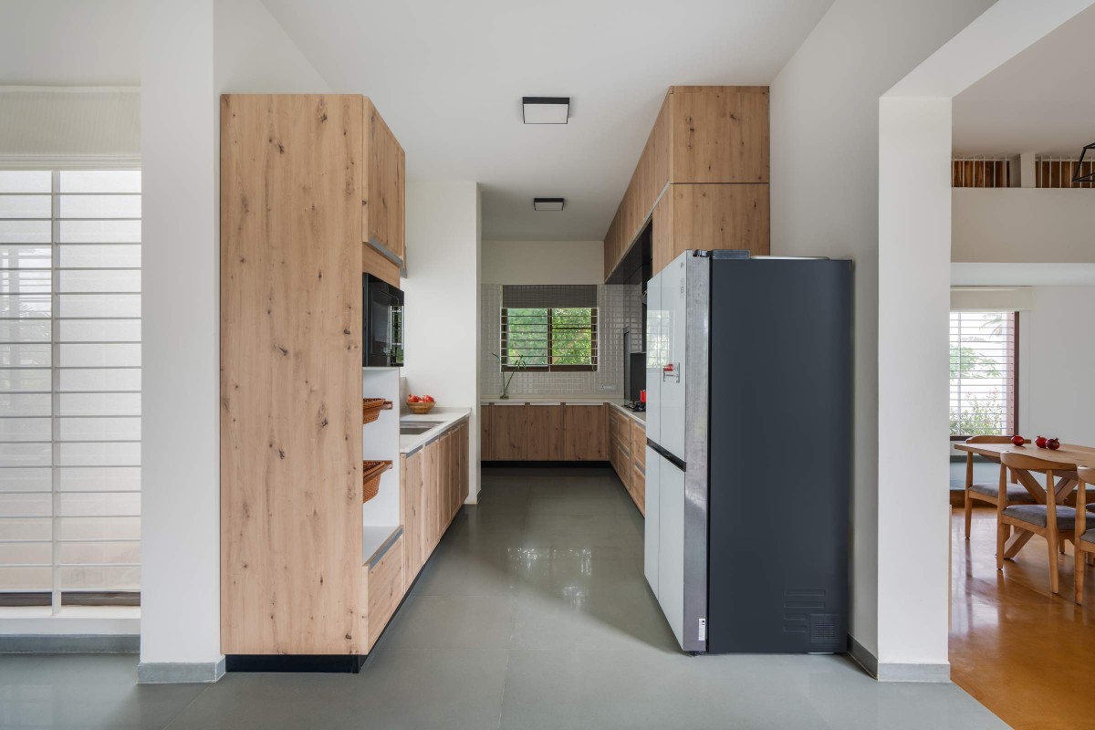 Kitchen of The Modern Pastoral House by Sudaiva Studio