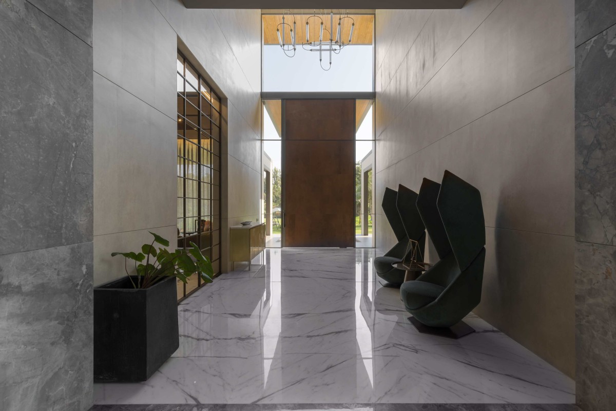 Entrance Foyer of Left House of Narola Villa by Essteam Design Services LLP