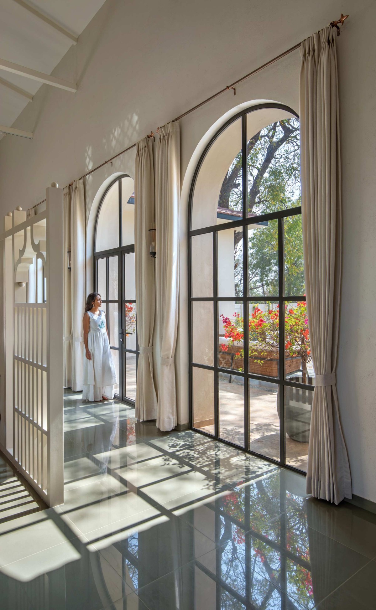 Passage to living and dining area of The Bird Song by Alter Architects