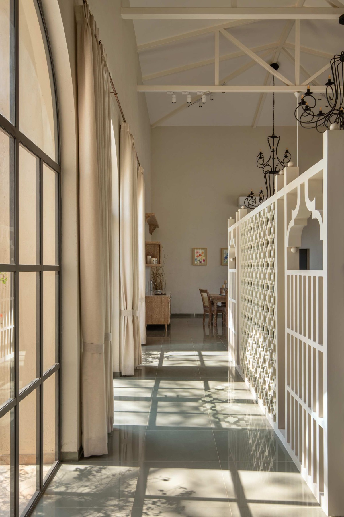 Passage to living and dining area of The Bird Song by Alter Architects