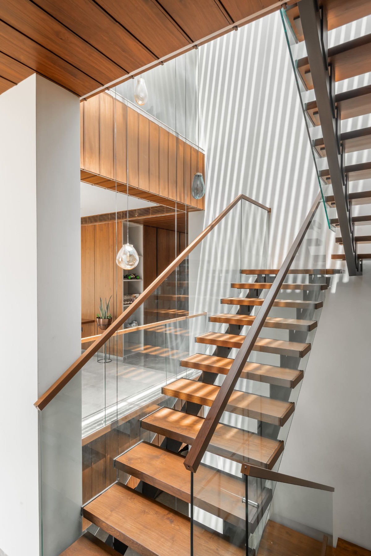 Minimalistic floating staircase of Veera Villa by Keystone Studio