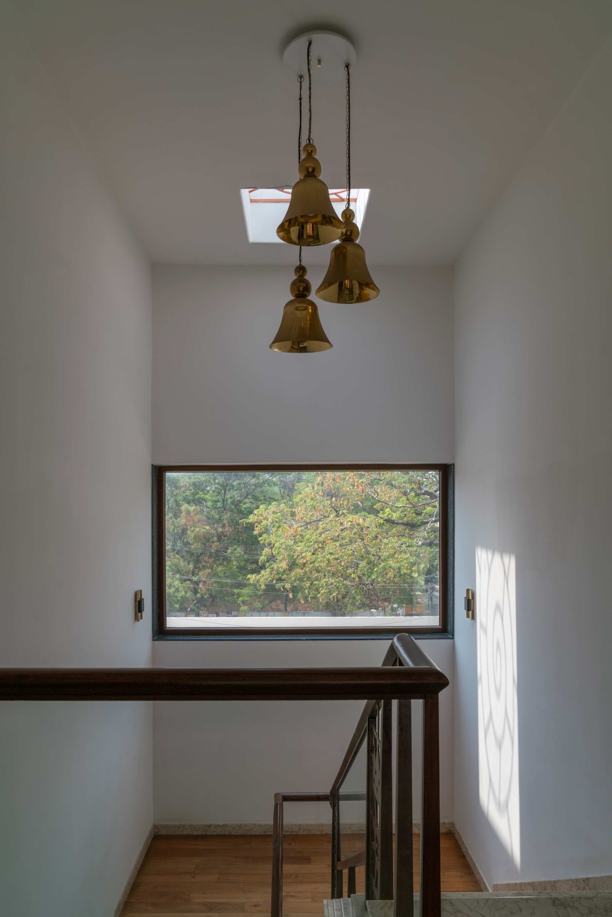 Skylight and Chandelier of Stack House by Vishwakarma Design Studio