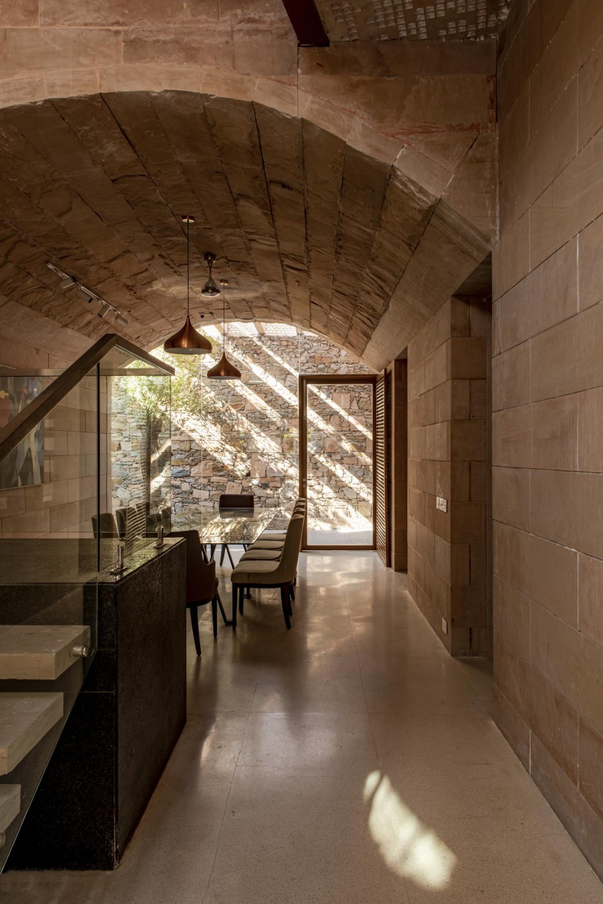 Dining of Stone House by Malik Architecture