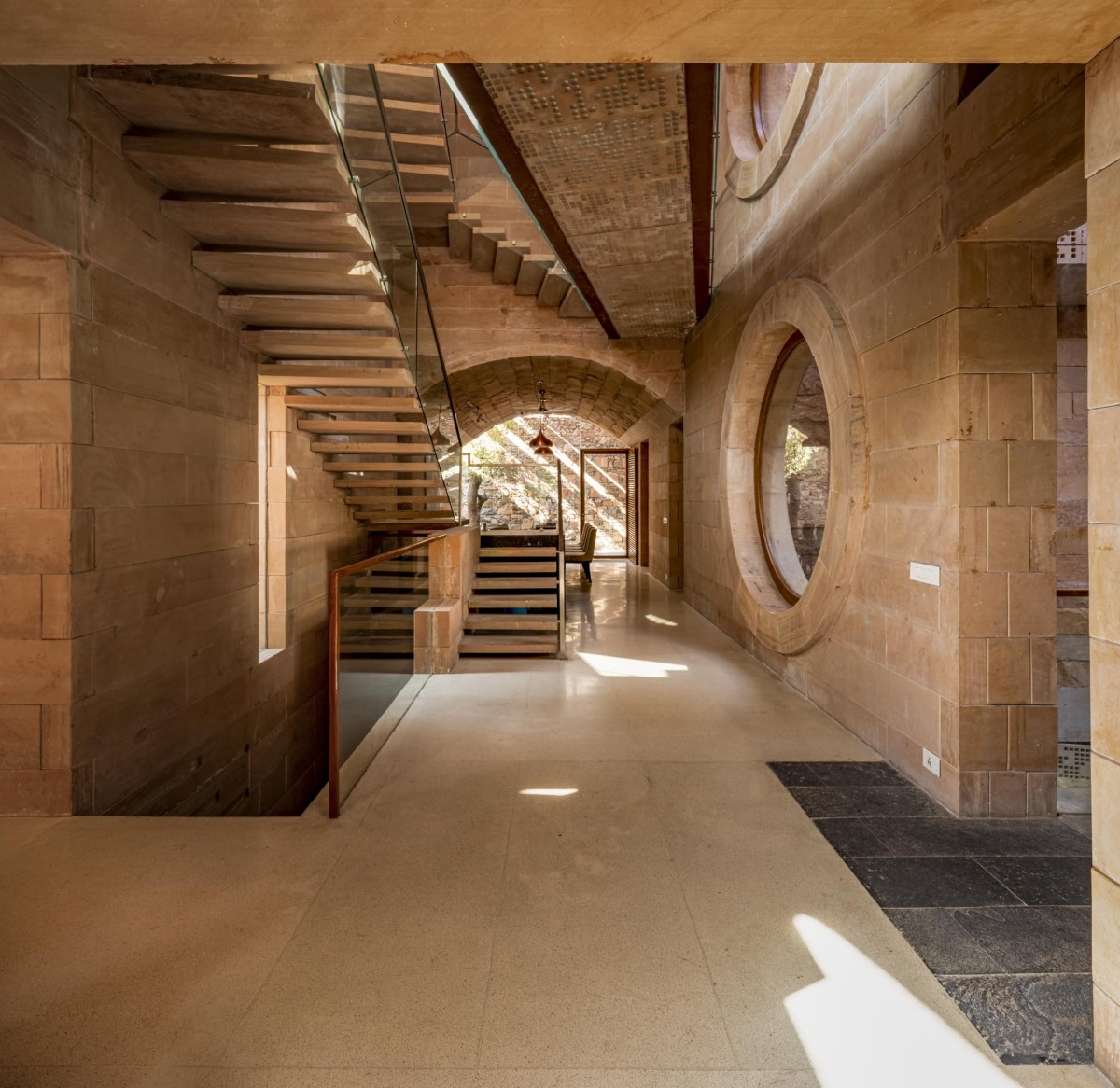 Lobby of Stone House by Malik Architecture