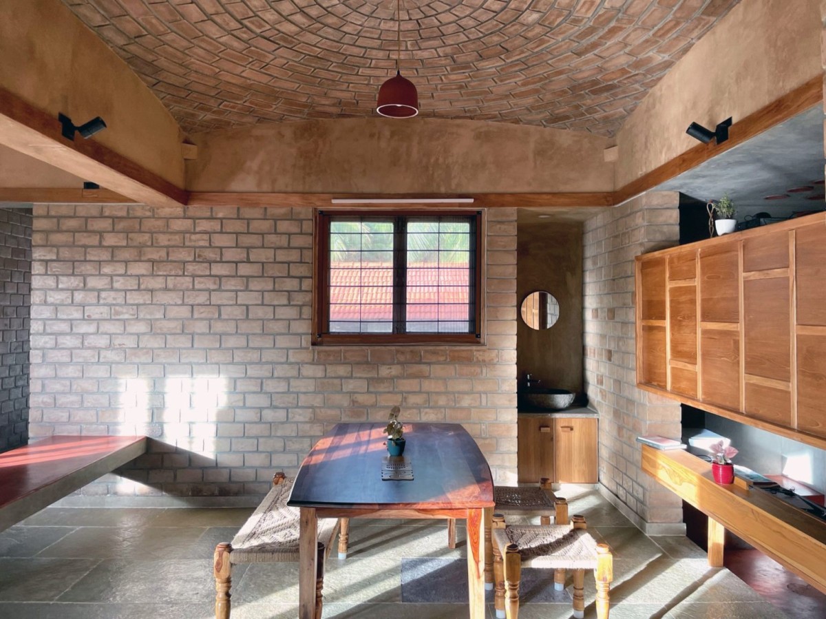 Dining area with the brick dome as roof of Makizham Thottam by Second Ground