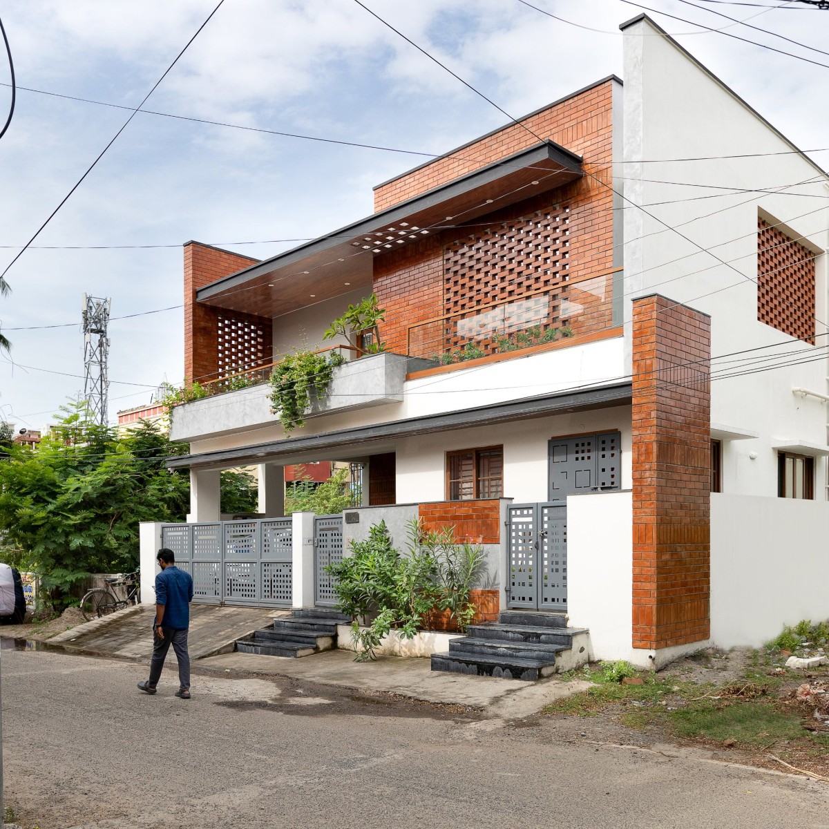 Exterior view of Perforated Plane House by D.L.E.A