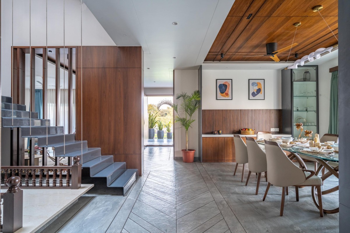 Passage between staircase and dining area of Vithai Residence by Studio AAD