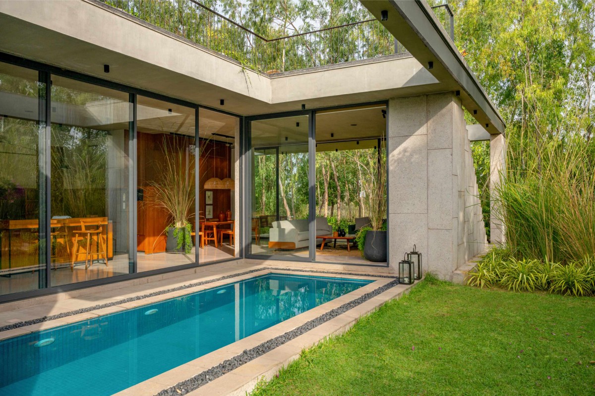 Pool view of House in Woods by Anarr Gunjaria Interiors