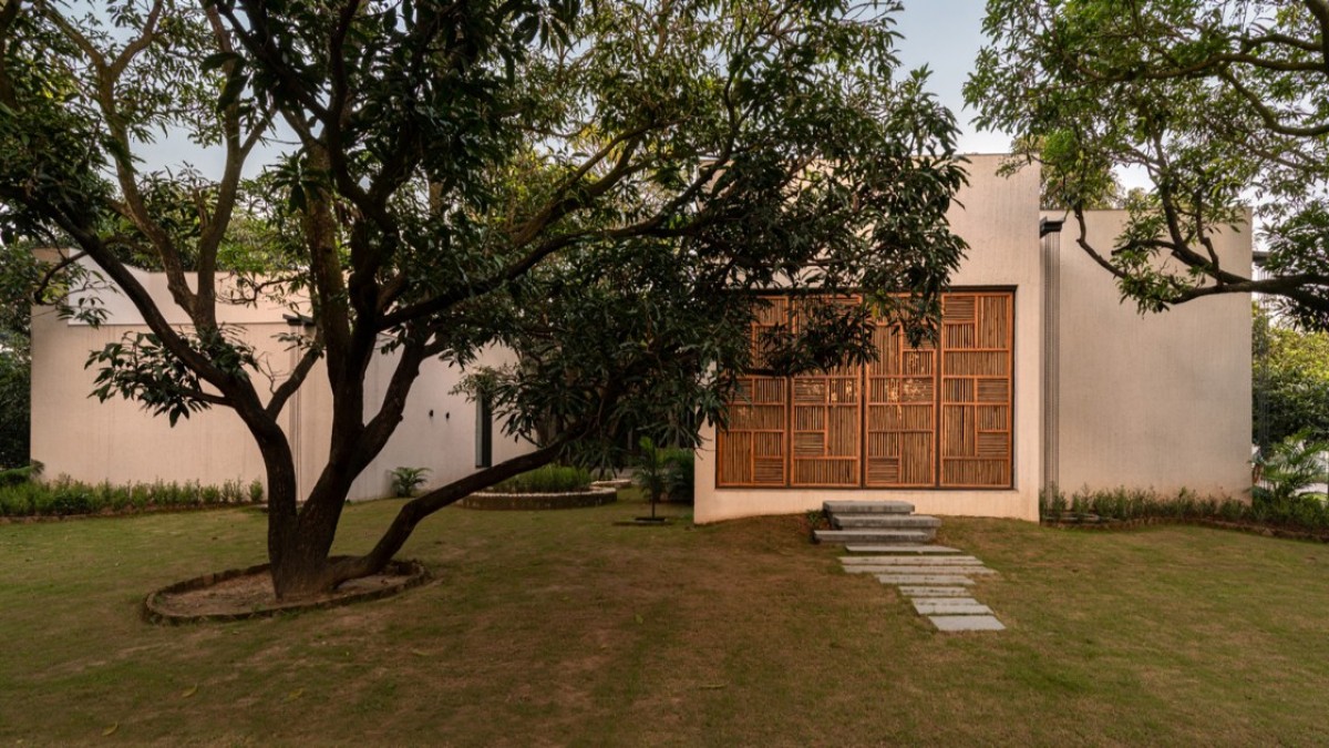 Dusk light exterior view of House of Mango Shadows by Design i.O Architects