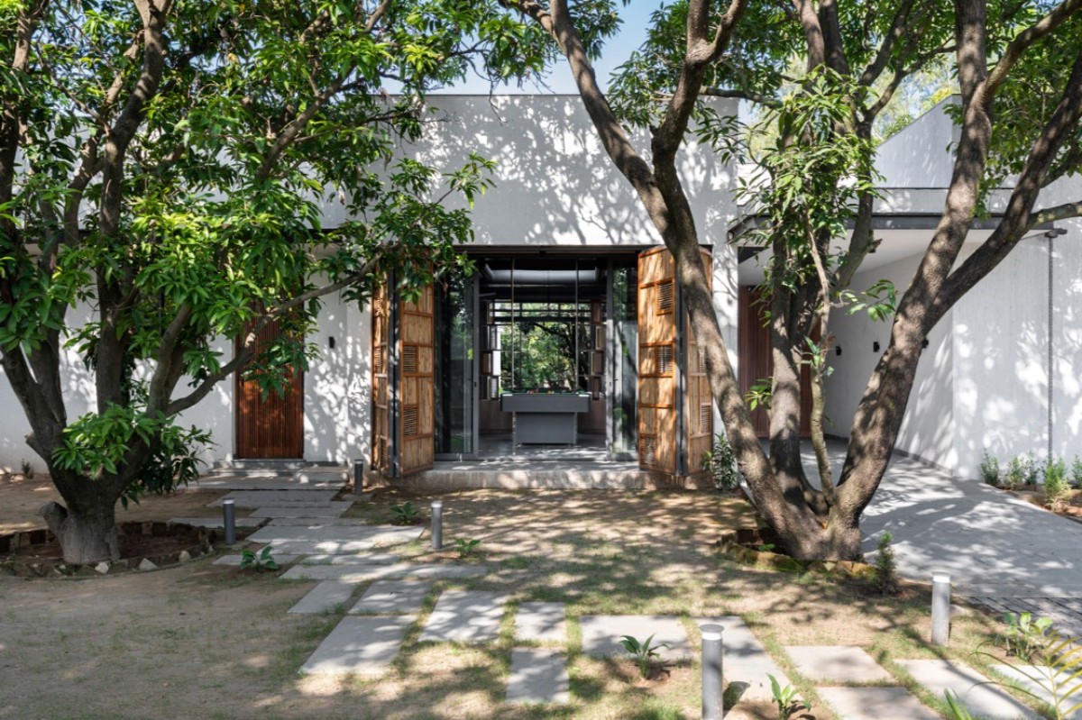 Side Porch of House of Mango Shadows by Design i.O Architects