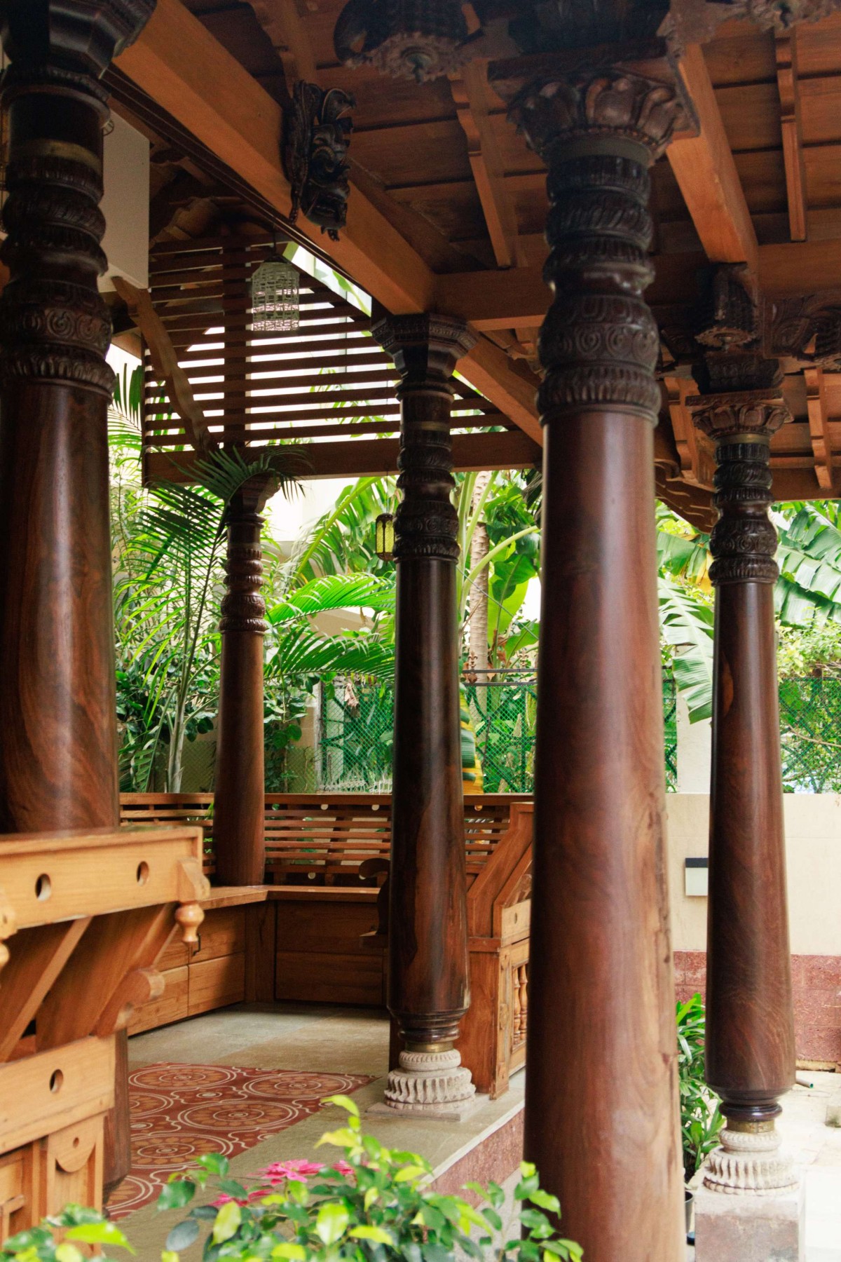 Detailed shot of wooden pillars of Shankar Residence by Brick and Stone