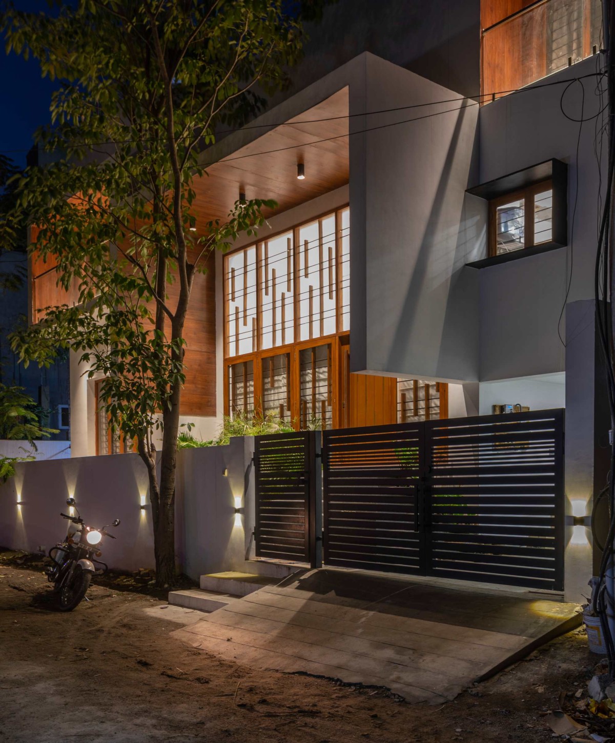 Dusk light exterior view of Level House by Ainthinai Projects