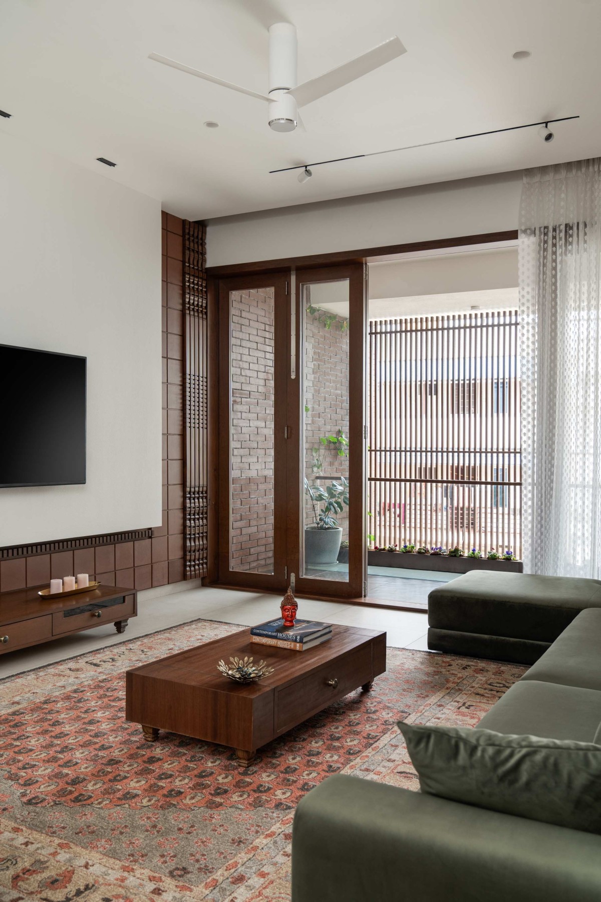 Family living room of Tanish by Jyaamiti Architectural Studio