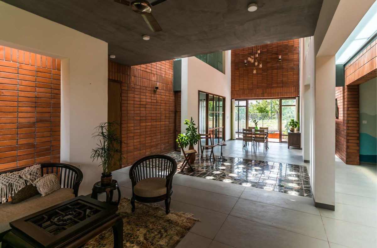 Living room of An Earthy Affair by Collage Architecture Studio