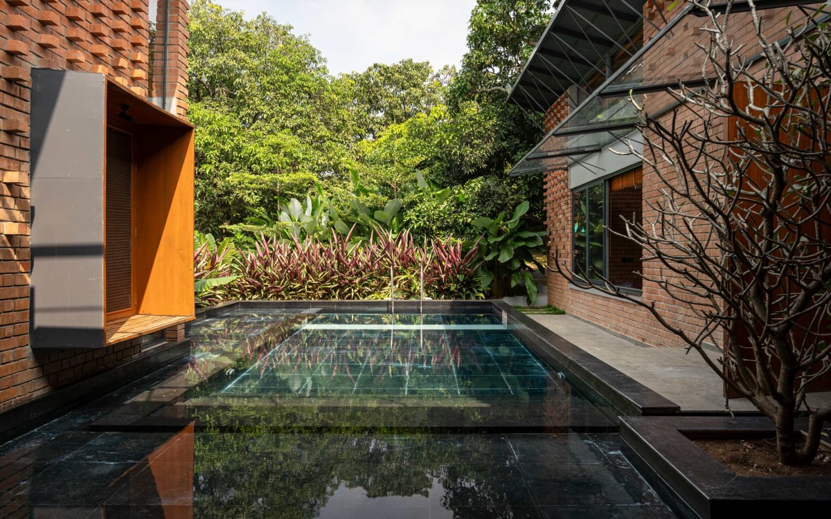 Pool view of Between the Mango Trees by Enviarch Studio