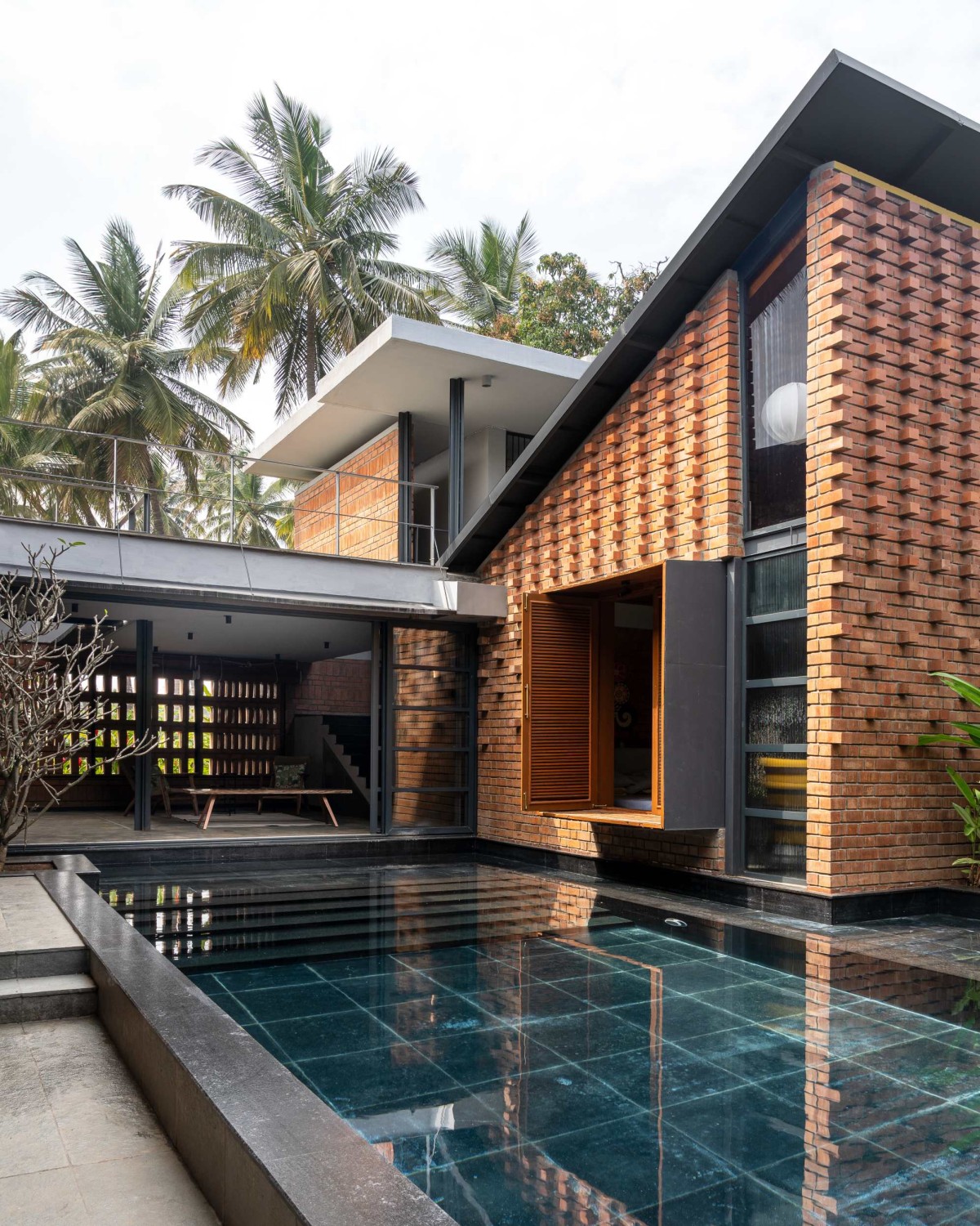 Pool view of Between the Mango Trees by Enviarch Studio