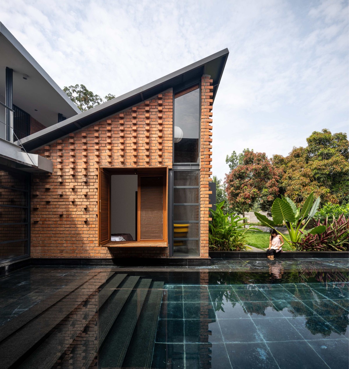 Pool view of Between the Mango Trees by Enviarch Studio