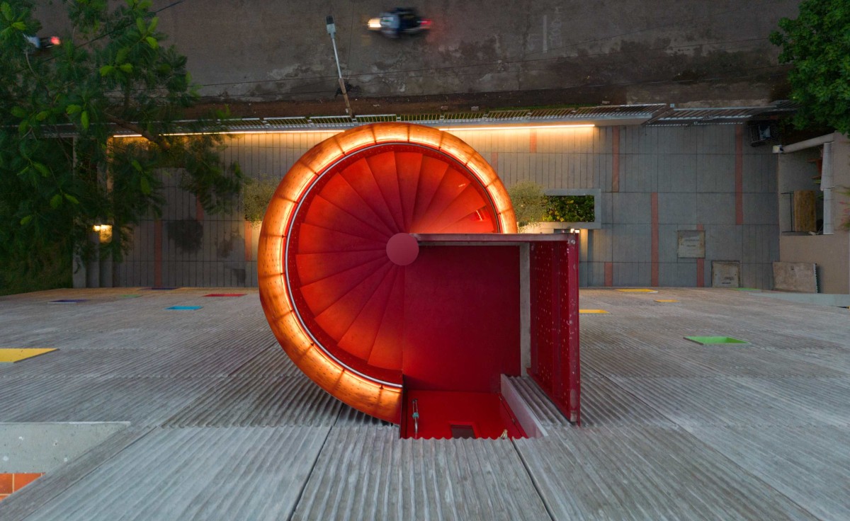 Dusk light view of spiral staircase of Learning Center at Quest by KSM Architecture