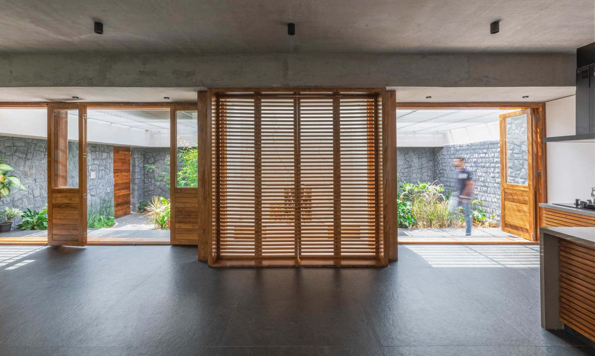 Pooja room to Kitchen view of In Between Gardens by A Threshold