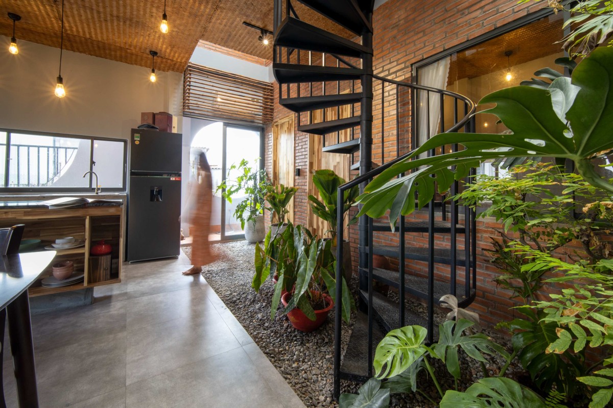 Kitchen to staircase view of Noah's Nest by Archiro Vietnam