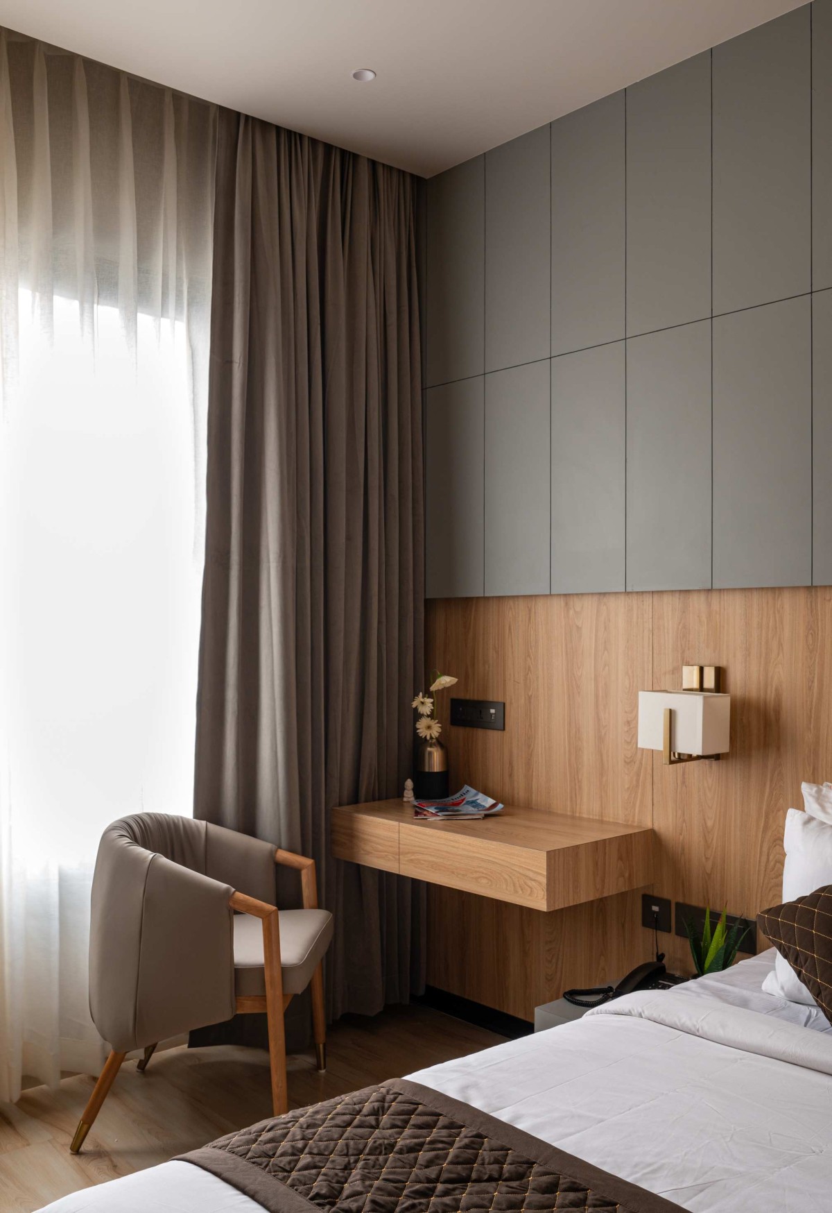 Delux room of The Buddha Avenue Hotel by W5 Architects