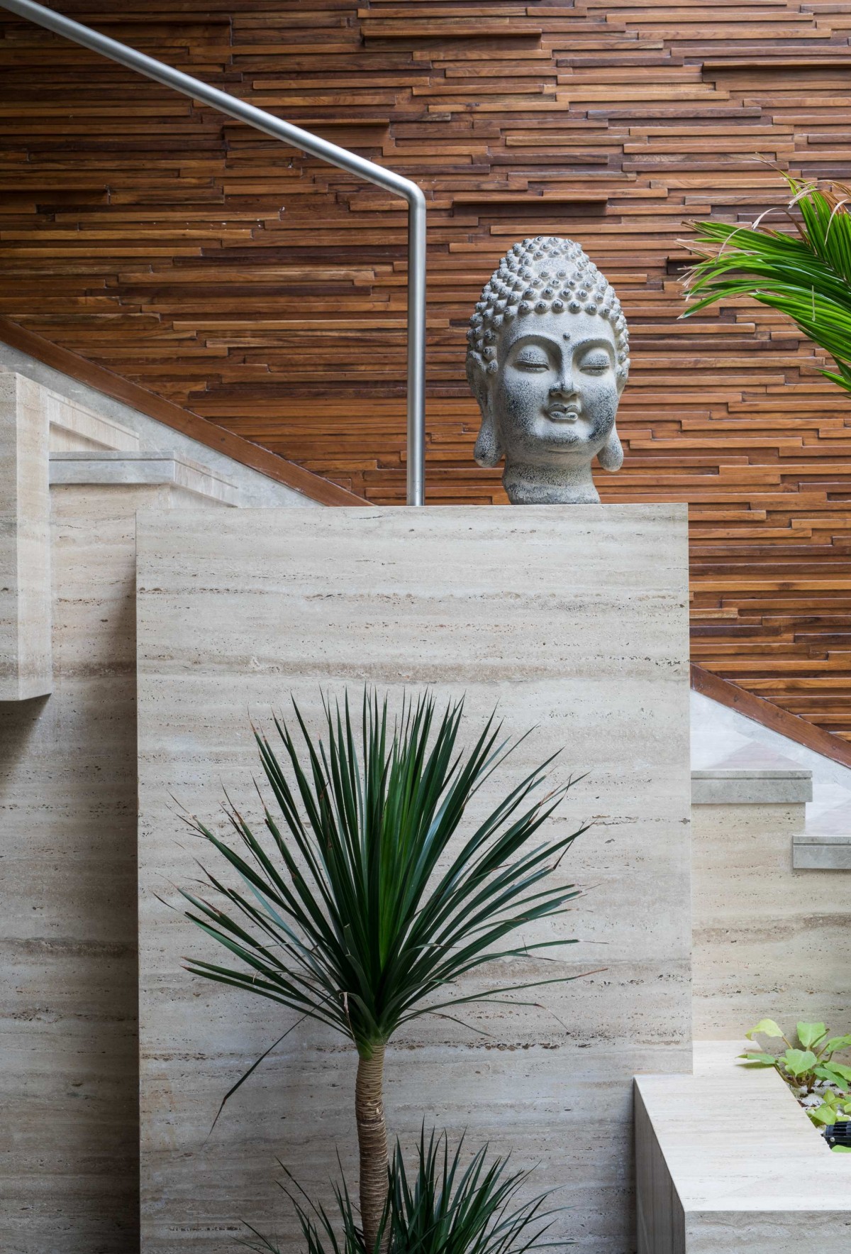 Sculptural staircase from courtyard to dining of H2 by Design plus