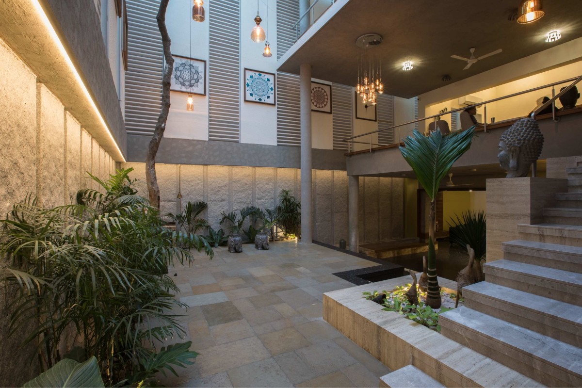 Mango tree courtyard finished with natural and local material of H2 by Design plus