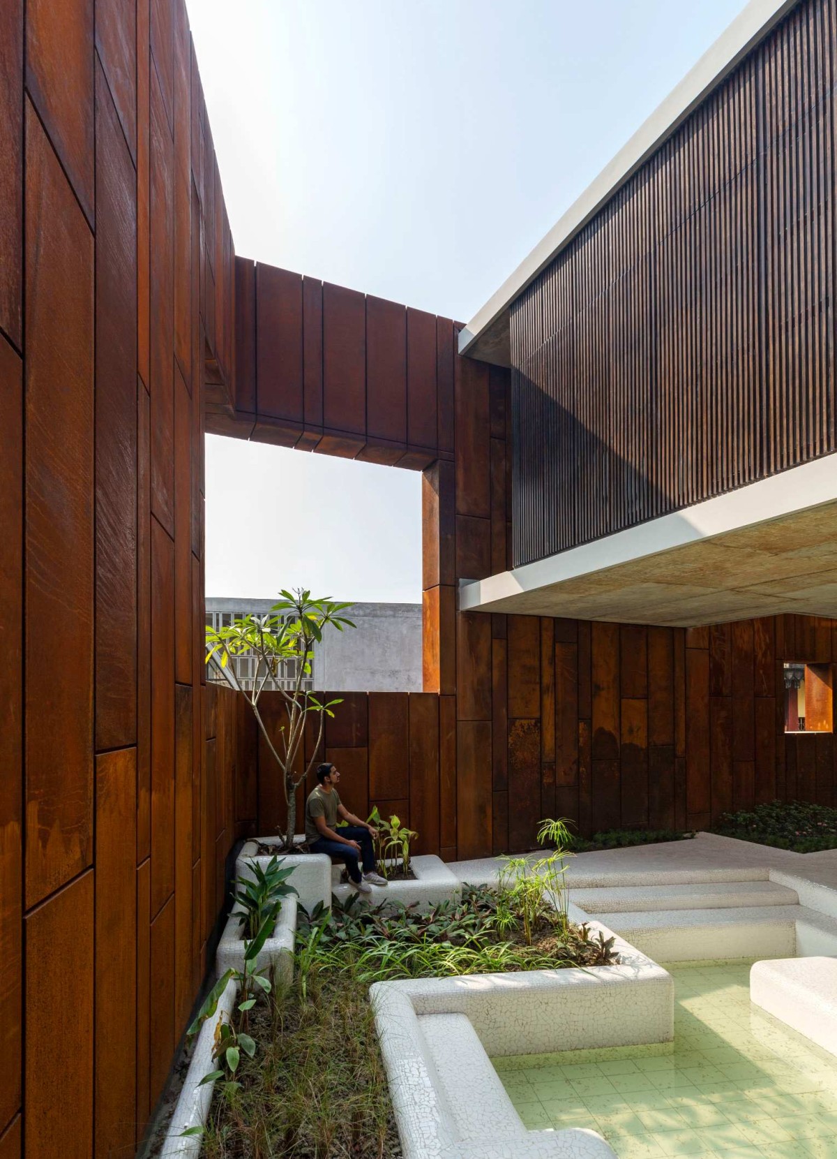 Bio-Pond Sitout of Wall House by Abin Design Studio
