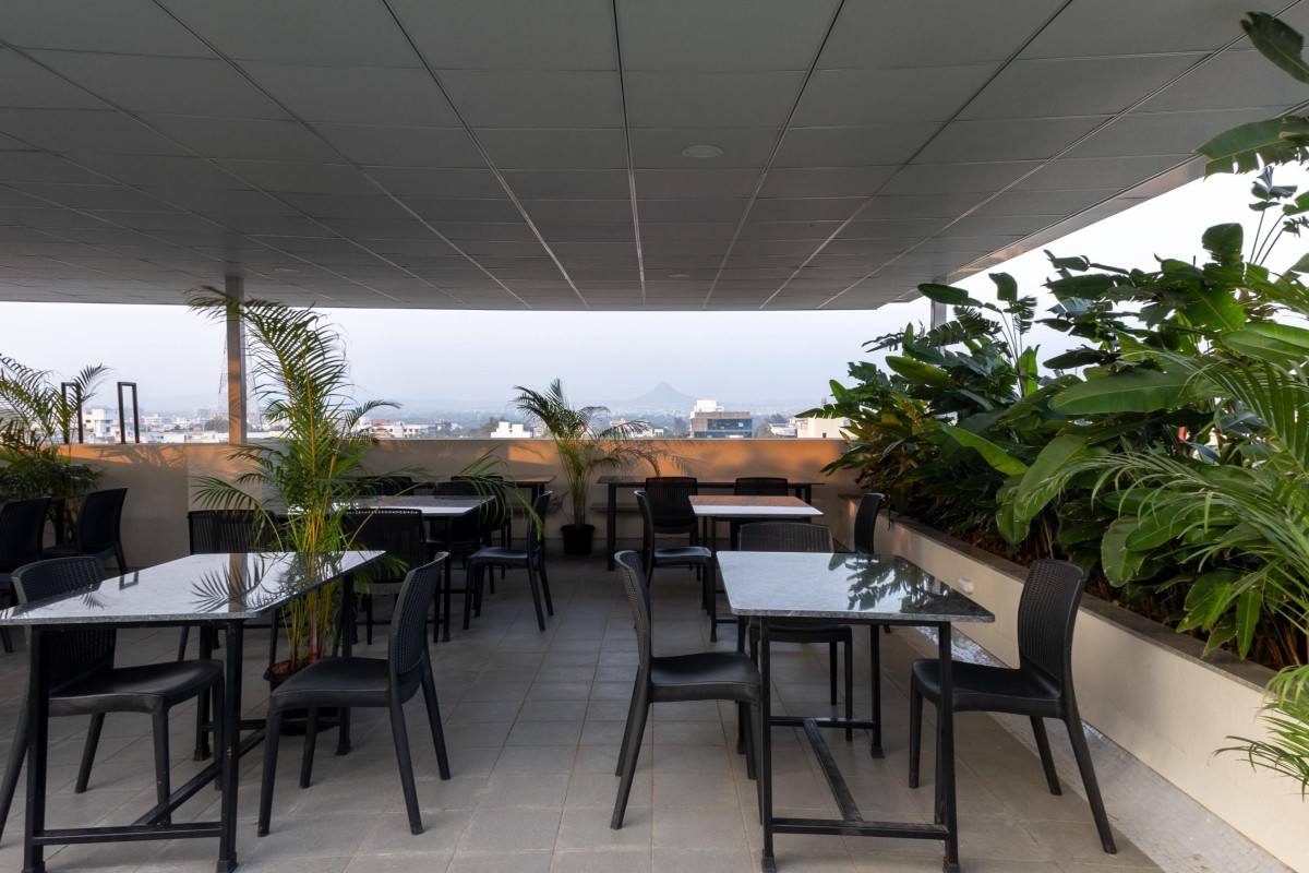 Rooftop dining of Amar Apex by S'thetic Design Studio