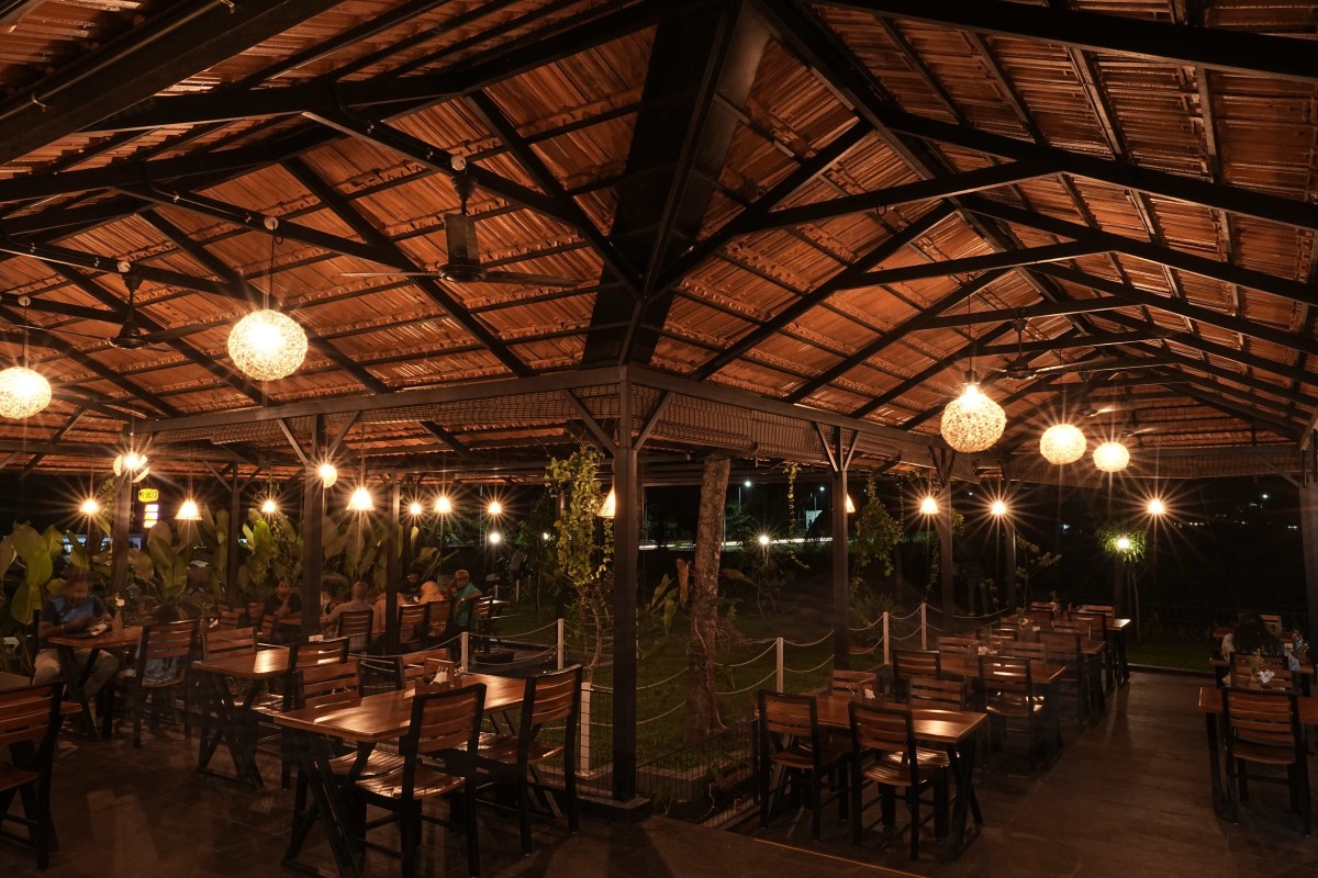 Dusk light view of open dining area of Manjal - The Portico by Lykke Architecture Studio