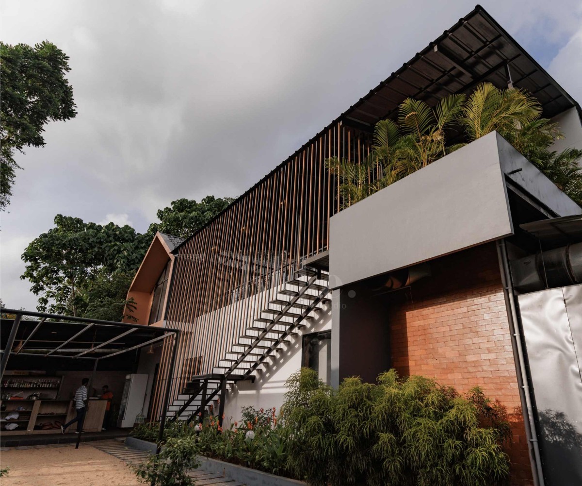 Kitchen and covered dining of Manjal - The Portico by Lykke Architecture Studio