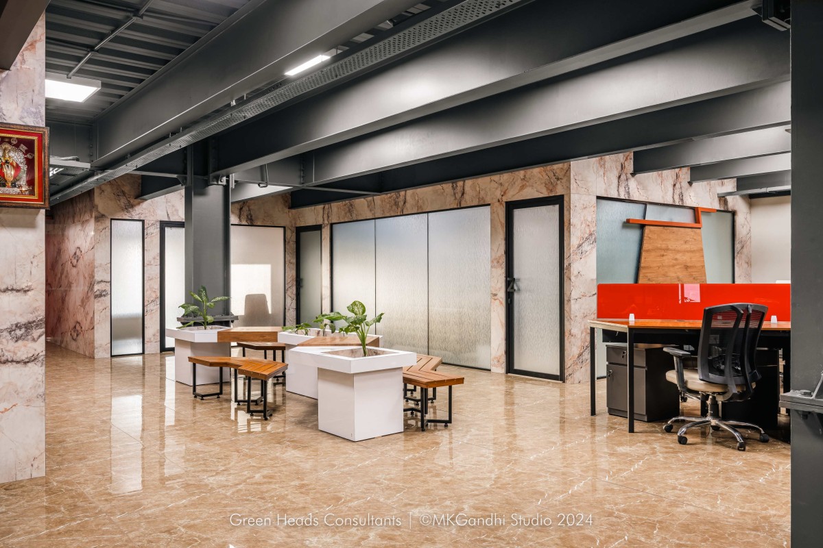 Casual Sitting/Waiting area to workstation view of Aztech Fluids & Machinery Ltd. by Green Heads Consultants LLP